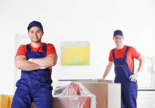 Careful loading of household furniture into a removals vehicle