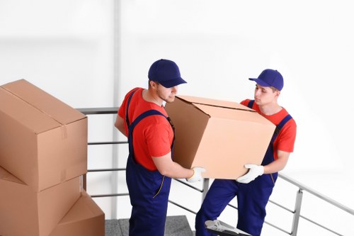 Man and van loading furniture in Kingston upon Thames near residential flats