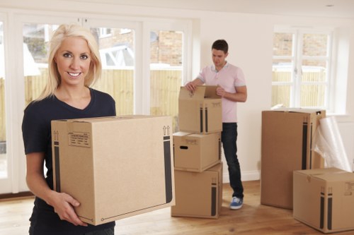Moving van loading items from a Kingston Upon Thames flat