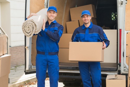 Packed boxes and furniture ready for transport during a Kingston move