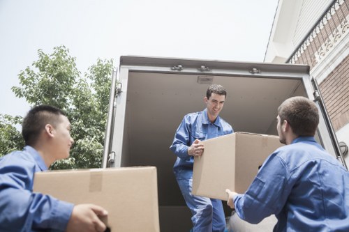 Movers protecting property and handling fragile items carefully