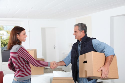 Careful wrapping of fragile household items during a local move