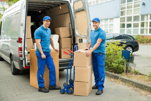 Packed boxes and moving equipment ready for a local relocation