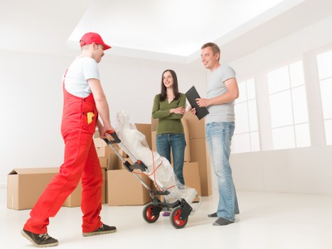 Unpacking boxes and organising rooms in a Kingston upon Thames property